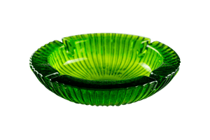 This is an Avocado Anchor Hocking Soreno Glass Ashtray from Heady Vintage available at Ritual Colorado. The beautiful green color is accented by a deep center well and four indents around the outside for easy storage of you joint, blunt, vape or dab gear.