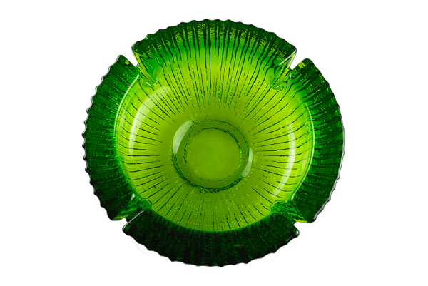 This is an Avocado Anchor Hocking Soreno Glass Ashtray from Heady Vintage available at Ritual Colorado. The beautiful green color is accented by a deep center well and four indents around the outside for easy storage of you joint, blunt, vape or dab gear.