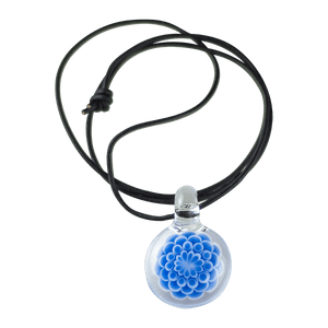 This is the Azure Burst Dot Stack Pendant from Faltermeier Glass available at Ritual Colorado. Exploding with tons of shades of blue and featuring an included leather cord this is an impressive piece of handmade glass art at a great price. 