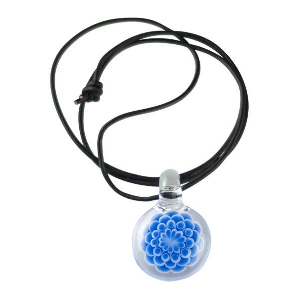 This is the Azure Burst Dot Stack Pendant from Faltermeier Glass available at Ritual Colorado. Exploding with tons of shades of blue and featuring an included leather cord this is an impressive piece of handmade glass art at a great price. 