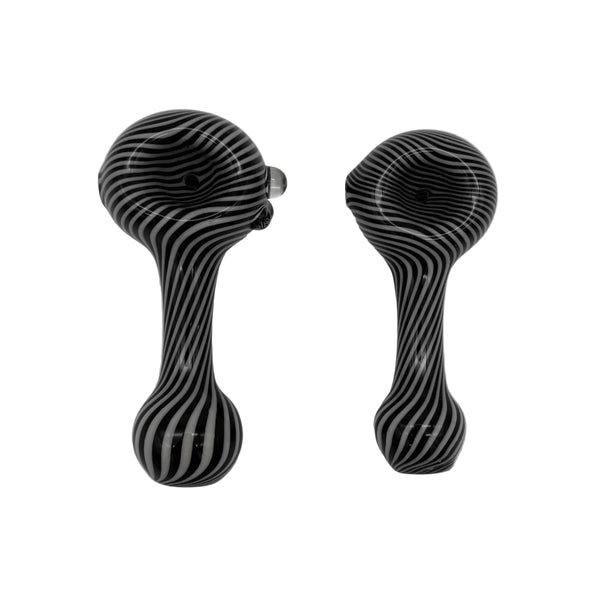 These are Black & White Swirl Spoon Pipes by Technicolor Tony available at Ritual Colorado. These handmade glass hand pipes feature intricate swirling black & white patterns for a stylish everyday option.