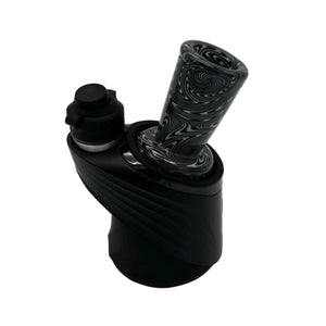 This is the Black & White Swirl Puffco Peak Glass Top by Technicolor Tony available at Ritual Colorado. Featuring a wide mouthpiece and tons of intricate patterns this is a fun and functional upgrade for your eRig.