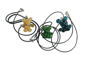 These are Glass Gummy Bear Pendants by Biting Glass available at Ritual Colorado. Fun handmade borosilicate glass jewelry piece made in Denver, Colorado.