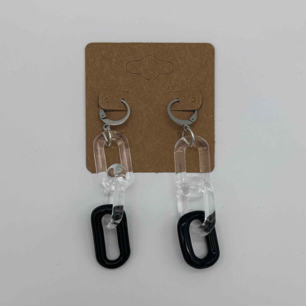 These are 3 link Black Glass Chain Earrings by Biting Glass available at Ritual Colorado. Featuring vibrant color accents these handmade jewelry pieces are the perfect accent accessory.