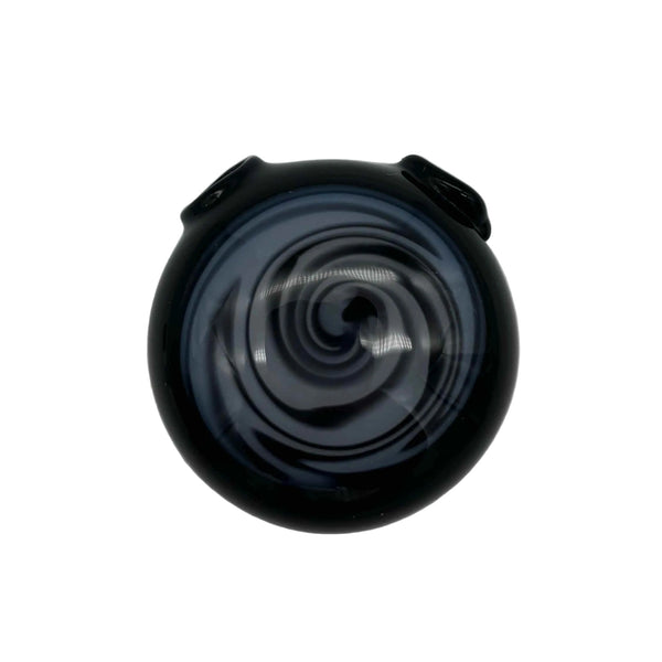 This is the Black / Black & White Color Swirl Glass Disc Pendant by Biting Glass available at Ritual Colorado. Featuring vibrant swirling color patterns and two holes so you can string it onto your favorite necklace. Handmade in Denver, Colorado.