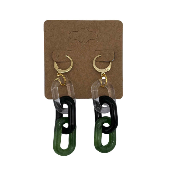 These are 3 link Black / Sparkle Green Glass Chain Earrings by Biting Glass available at Ritual Colorado. Featuring vibrant color accents these handmade jewelry pieces are the perfect accent accessory.