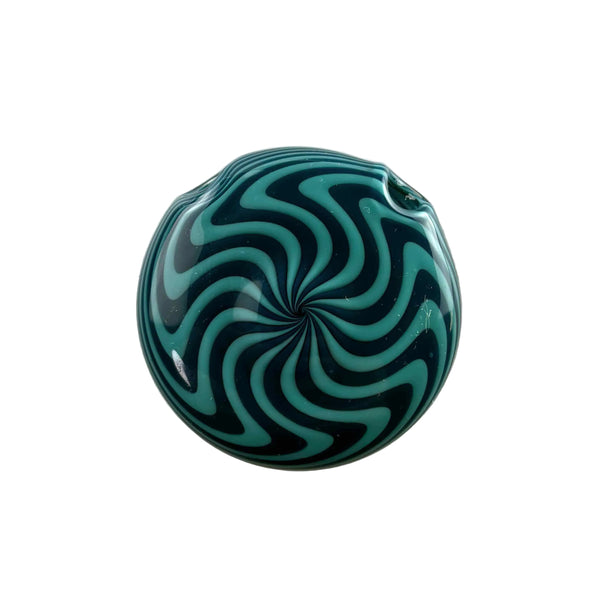 This is the Blue Spiral Disc Pendant by Technicolor Tony available at Ritual Colorado. A vibrant glass jewelry piece featuring intricate patterns and vibrant glass colors.