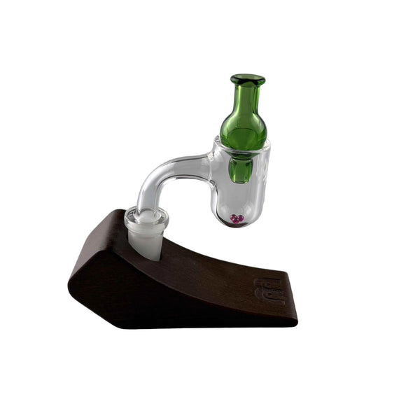 This is the Emerald Classic Bubble Cap 19mm by Ritual Essentials available at Ritual Colorado. Featuring vibrant colors, a flared handle and a bubble to seal your bangers these sleek carb caps are the perfect upgrade to your dab station.