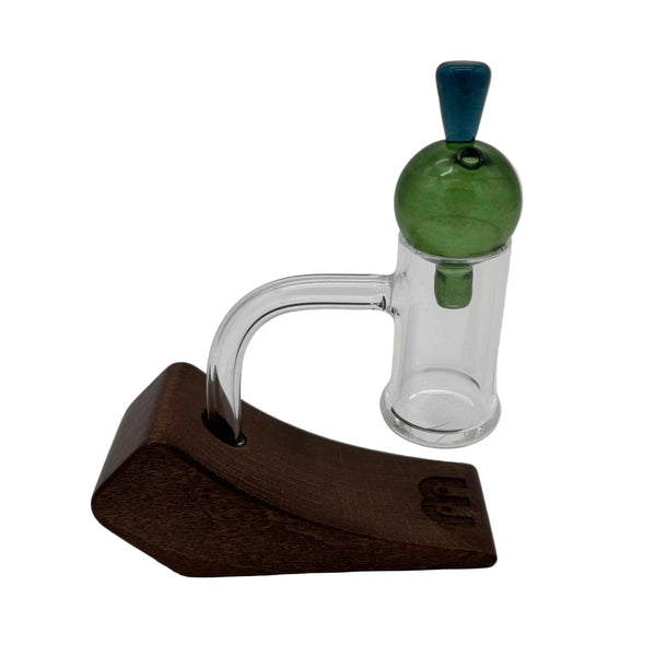 This is the Green Heady Hollow Bubble Cap by Biting Glass available at Ritual Colorado. Featuring a solid handle accented by a hollow bubble for precise airflow in your banger.
