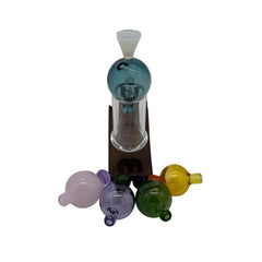 These are Heady Hollow Bubble Caps by Biting Glass available at Ritual Colorado. Featuring solid handles accented by a hollow bubble for precise airflow in your banger.