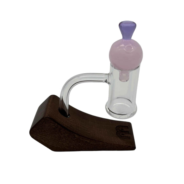 This is the Pink Heady Hollow Bubble Cap by Biting Glass available at Ritual Colorado. Featuring a solid handle accented by a hollow bubble for precise airflow in your banger.