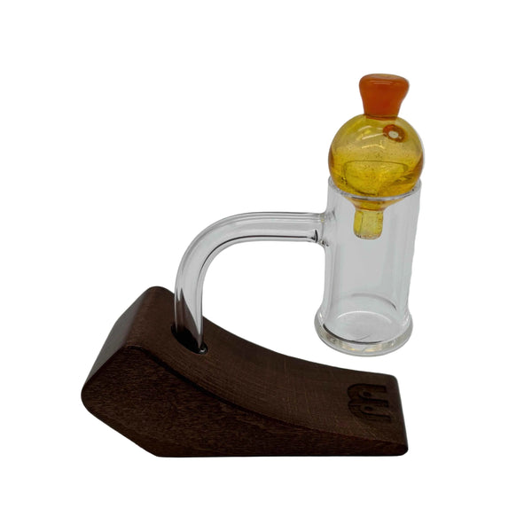 This is the Yellow Heady Hollow Bubble Cap by Biting Glass available at Ritual Colorado. Featuring a solid handle accented by a hollow bubble for precise airflow in your banger.