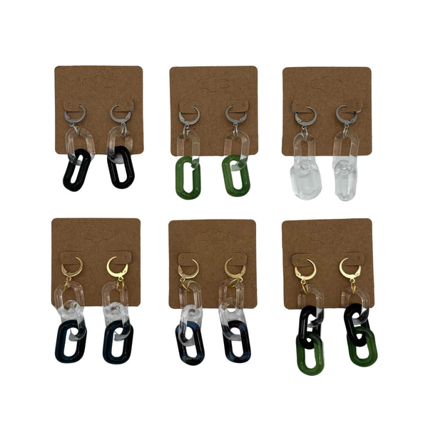 These are a collection of Glass Chain Earrings by Biting Glass available at Ritual Colorado. Featuring vibrant color accents and available in 2 and 3 link lengths these handmade jewelry pieces are the perfect accent accessory.