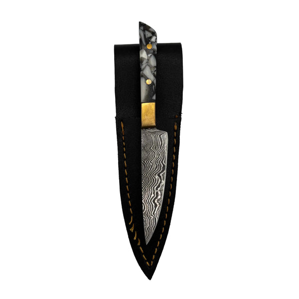 This is the Greyscale Chef's Knife Dab Tool from Dabmascus available at Ritual Colorado. It features a two-pin handle and high-quality Damascus Steel blade for a truly unique and special dab tool made here in the U.S.