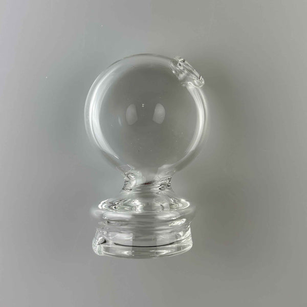 This is the Clear Disc Puffco Peak Dry Top by Technicolor Tony available at Ritual Colorado. A sleek low-profile top featuring a clear disc with an angled mouthpiece available for a great price.