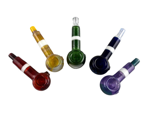 These are Colorful Stripe Spoon Pipes by Biting Glass available at Ritual Colorado. Vibrant handmade glass pipes made in Denver, CO featuring fun color accents and UV surprises.