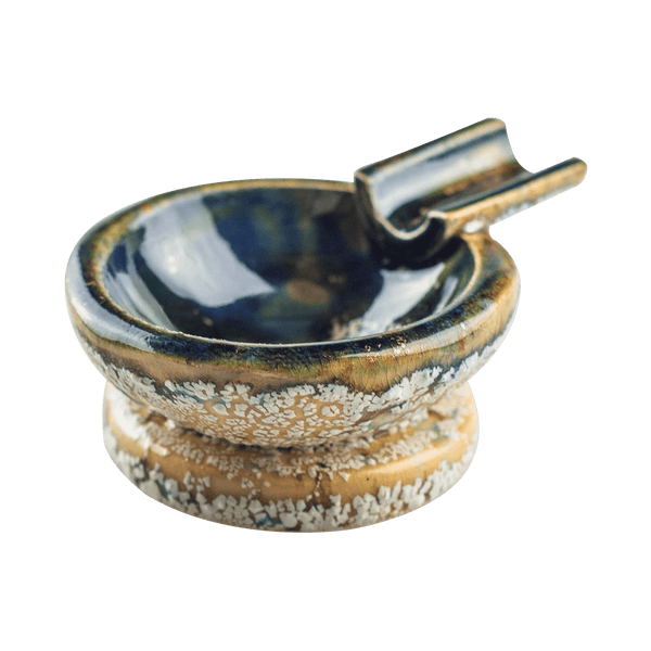 This is the Copacabana ceramic ash tray from Jaxel's Art available at Ritual Colorado. It features an extended arm perfect for holding your joint, dynavap or whip mouthpiece. Check out all the beautiful one-of-one ceramic products from Jaxel's Art and let us know if you're ever interested in a custom creation.