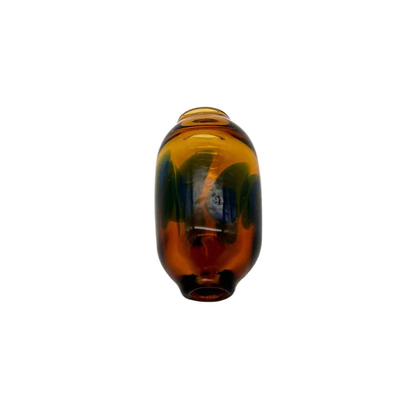 This is the Amber (Blue Dots) Dancing Dots Glass Macrame Bead by Biting Glass available at Ritual Colorado. Featuring color accent dots which swirl and dance around the bead for the perfect handmade upgrade to your craft project.