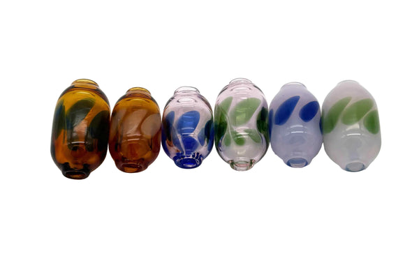These are Dancing Dots Glass Macrame Beads by Biting Glass available at Ritual Colorado. Featuring color accent dots which swirl and dance around the bead for the perfect handmade upgrade to your craft project.