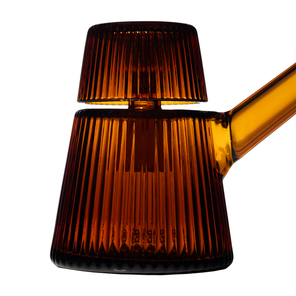 This is the Amber Deco Bubbler by NWTN Home available at Ritual Colorado. A beautiful, Art Deco inspired glass piece with an included 14mm slide for sleek sessions.