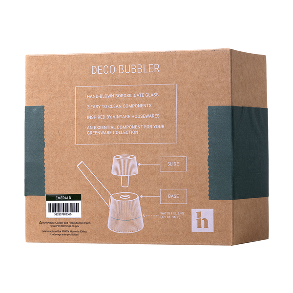 This is the Emerald Deco Bubbler by NWTN Home available at Ritual Colorado. A beautiful, Art Deco inspired glass piece with an included 14mm slide for sleek sessions.