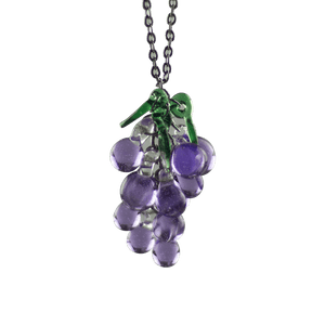 This is the Dionysus Grape Necklace by Hobbitkraft Glass available at Ritual Colorado. Featuring a gorgeous cluster of purple glass grapes accented by three green leaves for a one-of-a-kind jewelry piece.