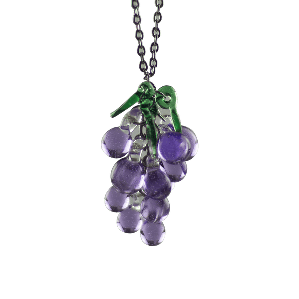 This is the Dionysus Grape Necklace by Hobbitkraft Glass available at Ritual Colorado. Featuring a gorgeous cluster of purple glass grapes accented by three green leaves for a one-of-a-kind jewelry piece.
