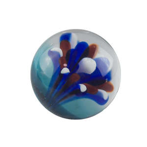 This is the Fireworks Marble by Biting Glass available at Handmade Glass Co. A fun red, white & blue handmade borosilicate glass marble backed by sparkly blue.