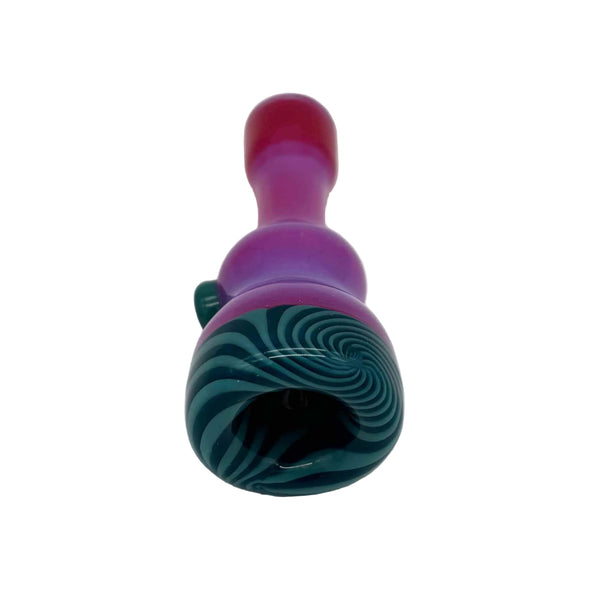 This is the Flapinko Chillum by Technicolor Tony available at Ritual Colorado. A sleek handmade glass one-hitter featuring vibrant colors and detailed linework on the bowl.