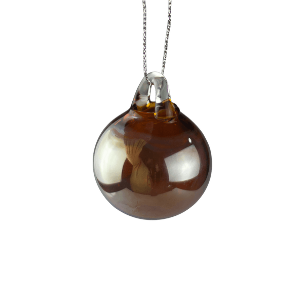 This is the Amber & Silver Holiday Globe Ornament by Biting Glass available at Ritual Colorado. Classic sphere ornaments in vibrant colors and featuring a built-in glass bail for longevity.