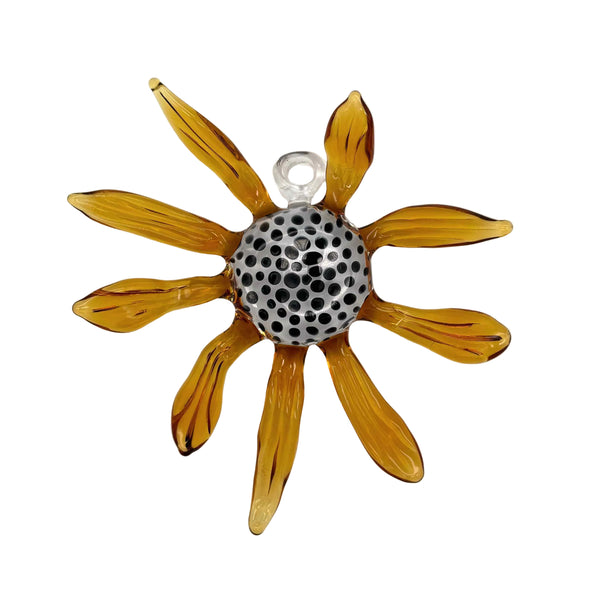 This is the Black-Eyed Susan Glass Flower Wall Hanging by Biting Glass available at Ritual Colorado. Featuring vibrant glass colors this handcrafted decor piece is the perfect way to spruce up a wall and comes alive in front of a window or other light source.
