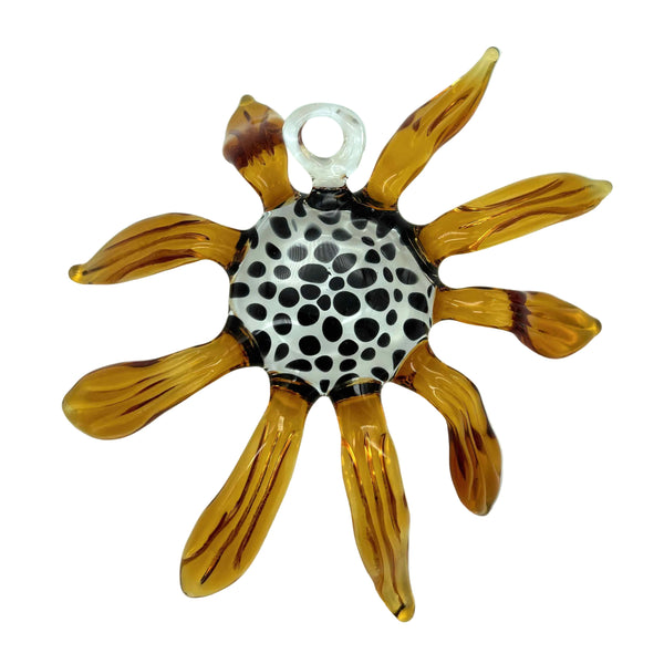 This is the Black-Eyed Susan Glass Flower Wall Hanging by Biting Glass available at Ritual Colorado. Featuring vibrant glass colors this handcrafted decor piece is the perfect way to spruce up a wall and comes alive in front of a window or other light source.