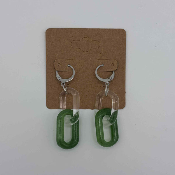 These are 2 link Sparkle Green Glass Chain Earrings by Biting Glass available at Ritual Colorado. Featuring vibrant color accents these handmade jewelry pieces are the perfect accent accessory.