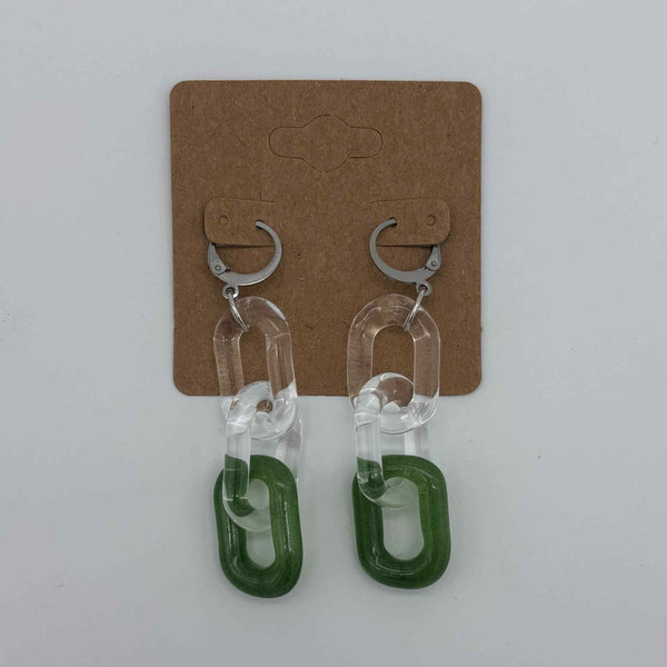 These are 3 link Sparkle Green Glass Chain Earrings by Biting Glass available at Ritual Colorado. Featuring vibrant color accents these handmade jewelry pieces are the perfect accent accessory.