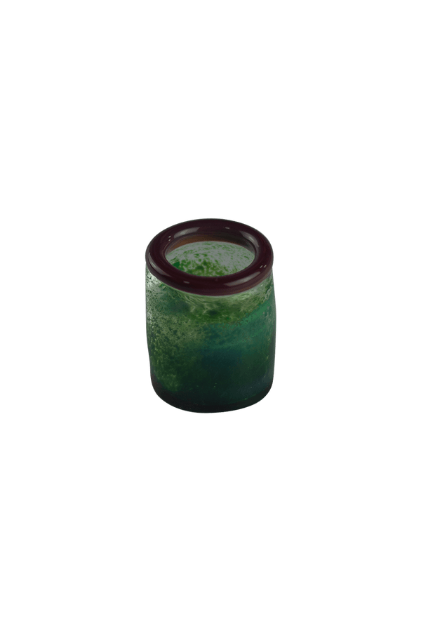 These are handmade green shot glasses by Technicolor Tony available at Ritual Colorado. Made in Denver, Colorado these vibrant glasses are the perfect addition to your barware.