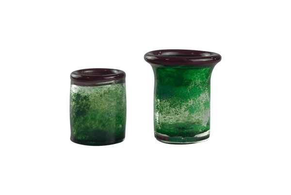These are handmade green shot glasses by Technicolor Tony available at Ritual Colorado. Made in Denver, Colorado these vibrant glasses are the perfect addition to your barware.