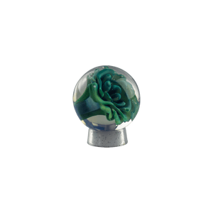 This is the Blue / Green Flower Marble by Biting Glass available at Ritual Colorado. A beautiful handmade glass marble featuring many shades of blue and green.