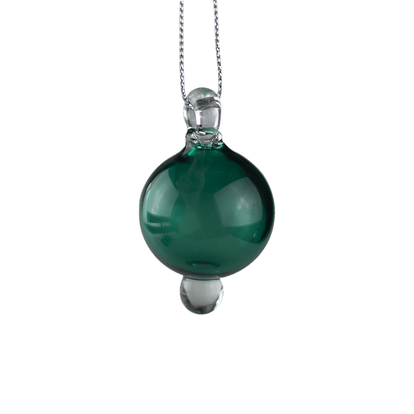 This is the Forest & Clear Holiday Globe Ornament by Biting Glass available at Ritual Colorado. Classic sphere ornaments in vibrant colors and featuring a built-in glass bail for longevity.