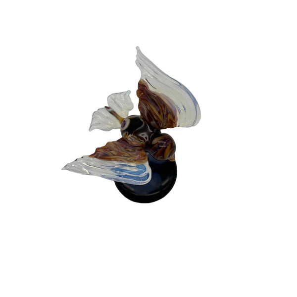 This is the Glass Soaring Hawk Sculpture by Biting Glass available at Ritual Colorado. A stylish borosilicate glass sculpture featuring a hawk soaring with wings out attached to a dark blue base with subtle "clouds".