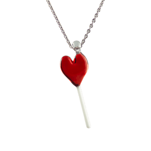 This is the Glass Heart Lollipop Necklace by Hobbitkraft Glass available at Ritual Colorado. A sleek all-glass pendant made in Denver, CO on a stainless steel chain.