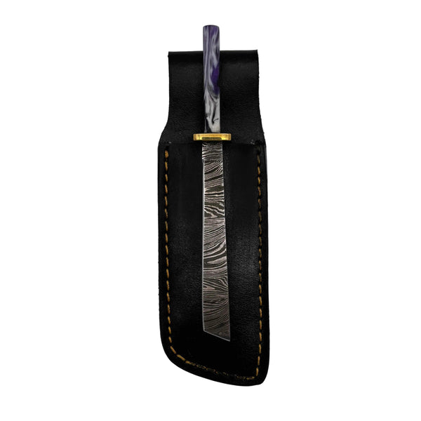 This is the Purple Swirl damascus steel Straight Katana dab tool from Dabmascus available at Ritual Colorado. Featuring intricate steel patterns on the blade accented by handmade handles with vibrant swirling colors.