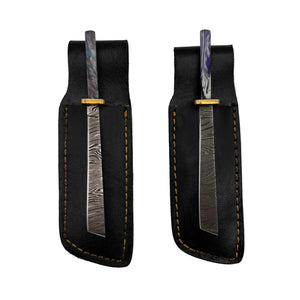 These are damascus steel Straight Katana dab tools from Dabmascus available at Ritual Colorado. Featuring intricate steel patterns on the blade accented by handmade handles with vibrant swirling colors.