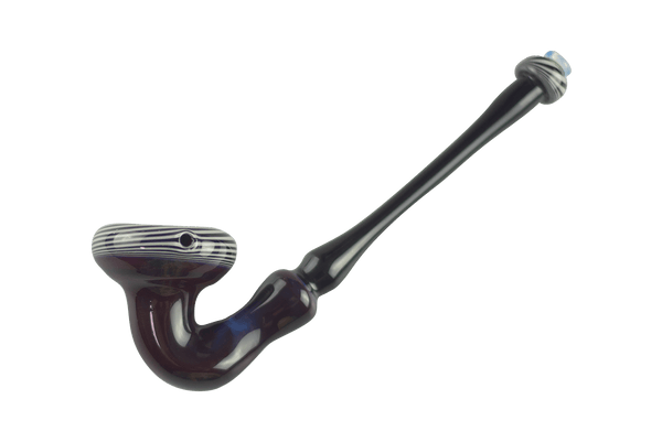 This is the King Sherlock Pipe by Technicolor Tony available at Ritual Colorado. A large hand pipe with clean lines and subtle color work for a one-of-one piece of glass art work.