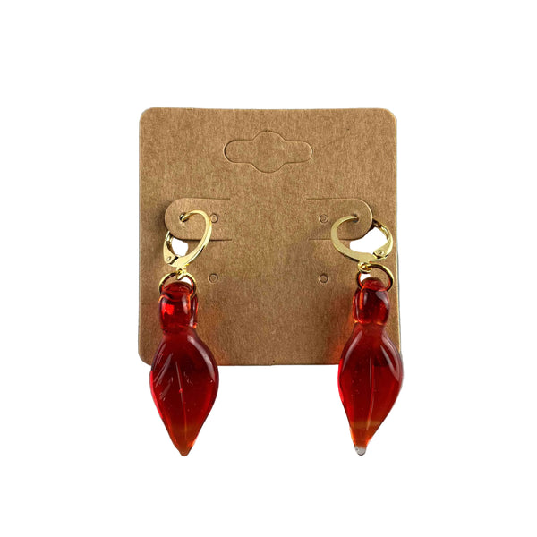 These are Red Leaf Dangle Earrings by Biting Glass available at Ritual Colorado. Featuring vibrant glass leaves on leverback earring clasps these are a fun way to show off your love for local glass.