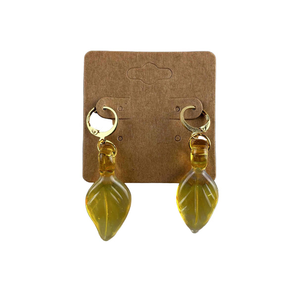 These are Yellow Leaf Dangle Earrings by Biting Glass available at Ritual Colorado. Featuring vibrant glass leaves on leverback earring clasps these are a fun way to show off your love for local glass.