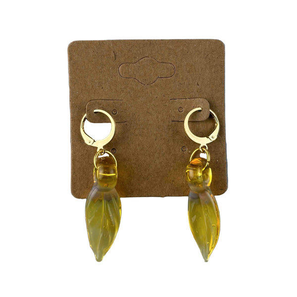 These are Yellow Leaf Dangle Earrings by Biting Glass available at Ritual Colorado. Featuring vibrant glass leaves on leverback earring clasps these are a fun way to show off your love for local glass.