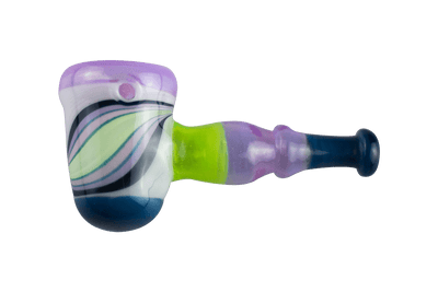 This is the Purple Swirl Hammer Pipe by Technicolor Tonys available at Ritual Colorado. The beautiful heady hand pipe features a carb on the left side of the bowl and vibrant green and purple glass colors.