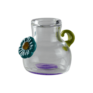 This is the Little Glass Flower Jar from Technicolor Tonys available at Ritual Colorado. This beautiful heady jar is available at a great price and features a flower and leaf accent as well as purple lollipop glass in the base.