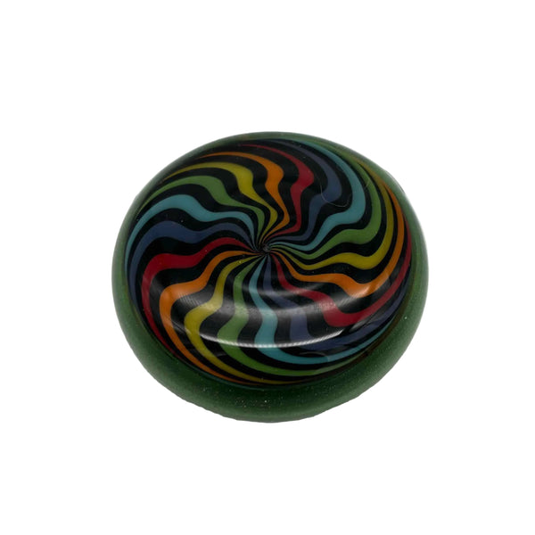 This is the vibrant Rainbow Swirl Disc Pendant by Biting Glass available at Ritual Colorado. Featuring an intricate color pattern accented by sparkle green glass on the back this is a bold and stylish jewelry piece.