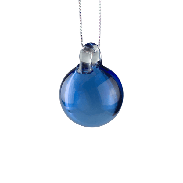 This is the Blue Holiday Globe Ornament by Biting Glass available at Ritual Colorado. Classic sphere ornaments in vibrant colors and featuring a built-in glass bail for longevity.